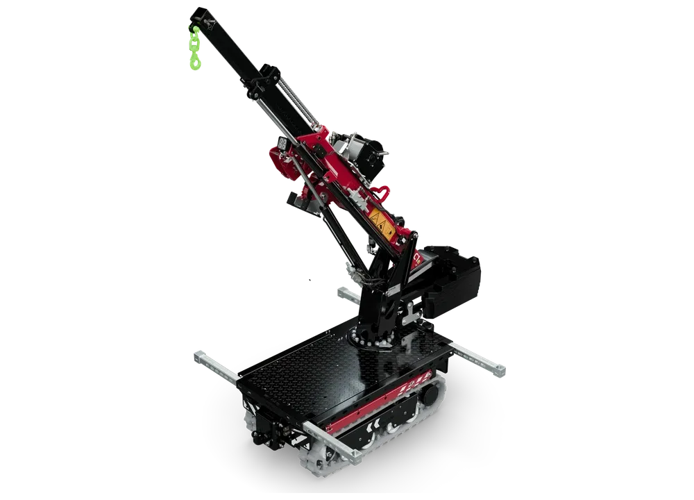 Mini grue C1e Gen 2 HOEFLON en position de travail, flèche télescopique relevée et supports latéraux sortis, vue de trois quarts.
